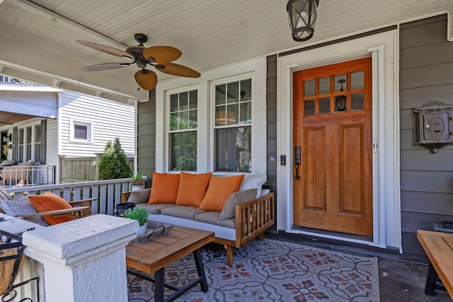 exterior space with covered porch, ceiling fan, and an outdoor living space