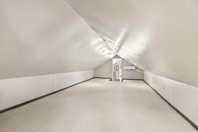 bonus room with baseboards, lofted ceiling, and carpet floors