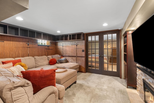 living room with a fireplace, carpet, french doors, and recessed lighting