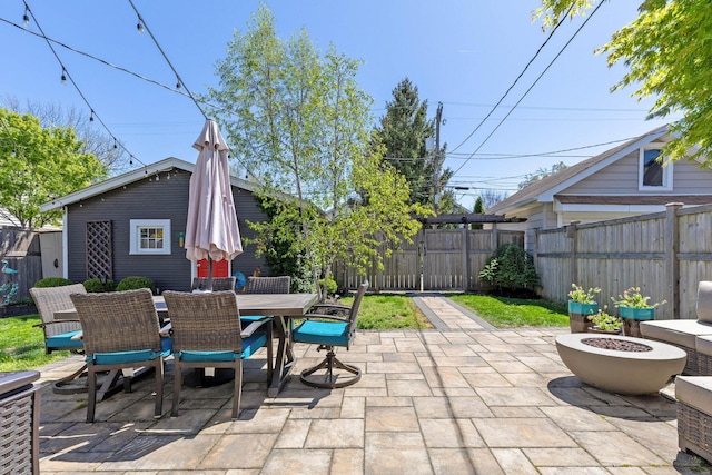 view of patio with a fenced backyard and outdoor dining area