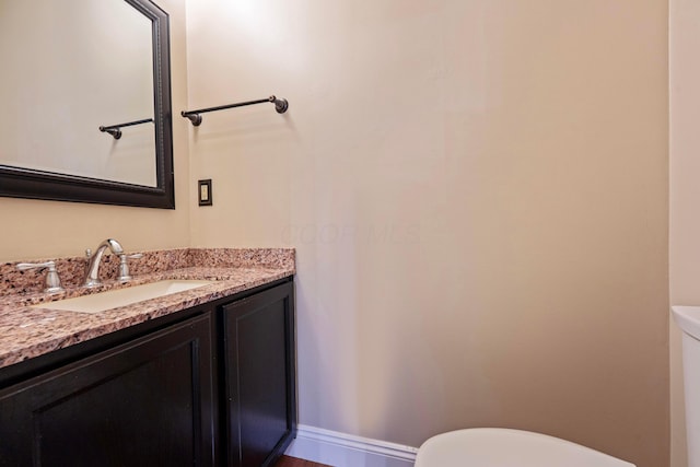 488 Springwood Lake Dr, Columbus, OH 43230 - bathroom featuring toilet, vanity, baseboards, and wood finished floors
