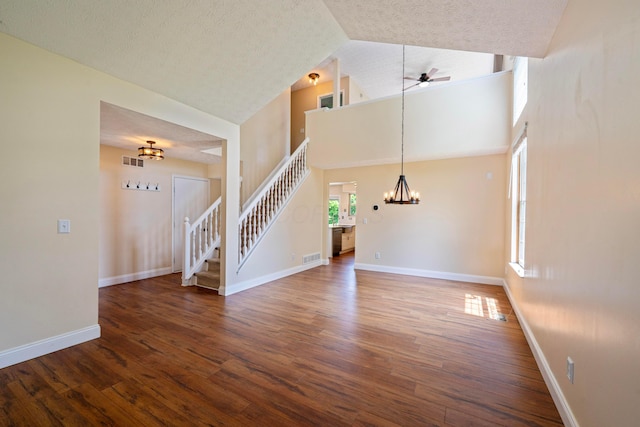488 Springwood Lake Dr, Columbus, OH 43230 - unfurnished living room featuring a chandelier, stairs, a ceiling fan, wood finished floors, and high vaulted ceiling
