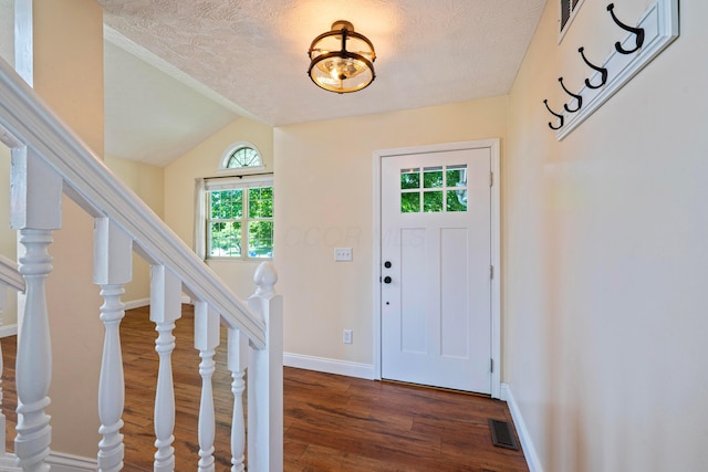 488 Springwood Lake Dr, Columbus, OH 43230 - foyer with dark wood-style floors, a textured ceiling, lofted ceiling, stairs, and baseboards