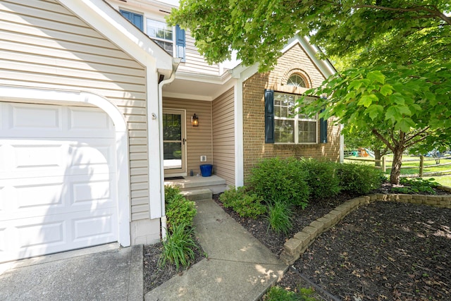 488 Springwood Lake Dr, Columbus, OH 43230 - doorway to property with brick siding and an attached garage