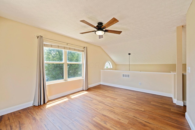 488 Springwood Lake Dr, Columbus, OH 43230 - additional living space with a ceiling fan, wood finished floors, a textured ceiling, baseboards, and lofted ceiling