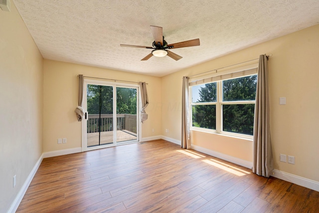 488 Springwood Lake Dr, Columbus, OH 43230 - unfurnished room featuring wood finished floors, ceiling fan, a textured ceiling, and baseboards