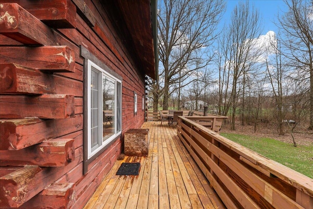 deck featuring outdoor dining area