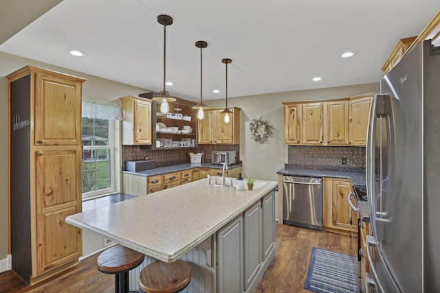 18738 State Route 327, Laurelville, OH 43135 - kitchen with a sink, a kitchen island, stainless steel appliances, and dark wood-style floors