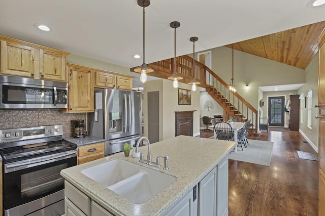 18738 State Route 327, Laurelville, OH 43135 - kitchen with tasteful backsplash, appliances with stainless steel finishes, a sink, dark wood-style floors, and vaulted ceiling