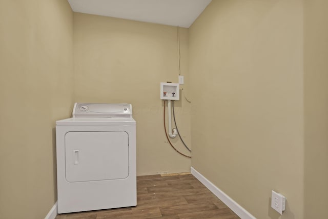 18738 State Route 327, Laurelville, OH 43135 - clothes washing area featuring baseboards, wood finished floors, laundry area, and washer / dryer