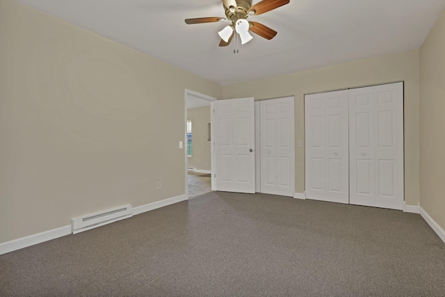 18738 State Route 327, Laurelville, OH 43135 - unfurnished bedroom featuring a baseboard radiator, multiple closets, dark carpet, and baseboards