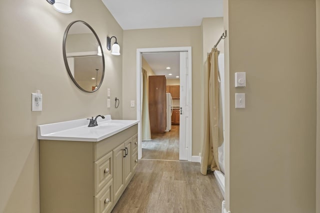 18738 State Route 327, Laurelville, OH 43135 - full bathroom with baseboards, curtained shower, wood finished floors, and vanity