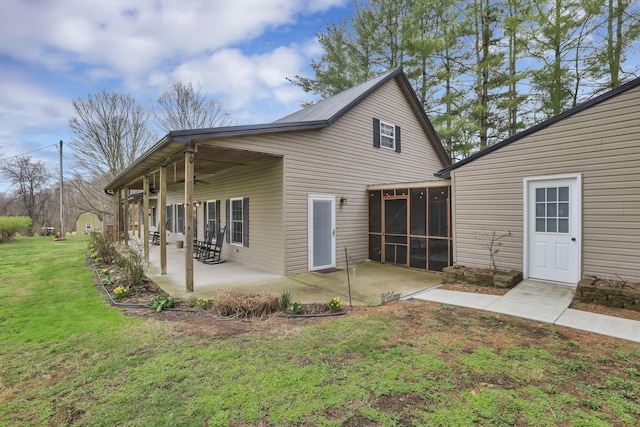 18738 State Route 327, Laurelville, OH 43135 - back of property with a lawn, a sunroom, a patio, and a ceiling fan