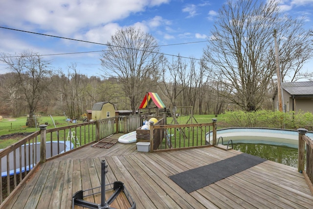 18738 State Route 327, Laurelville, OH 43135 - wooden deck featuring a lawn and an outbuilding