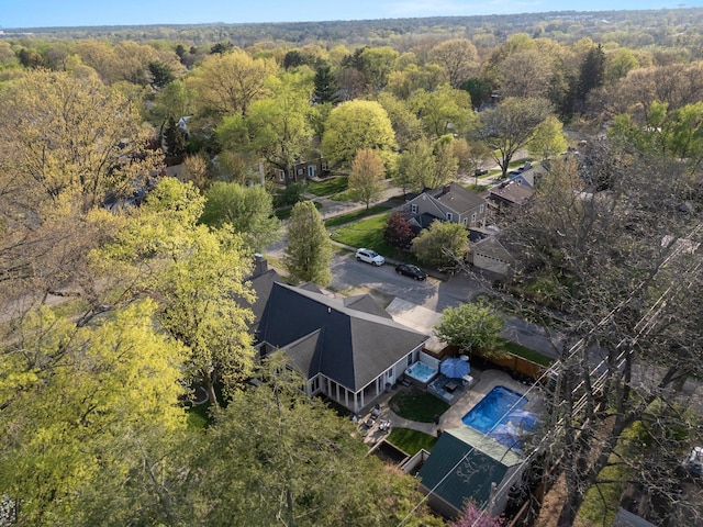 drone / aerial view featuring a forest view