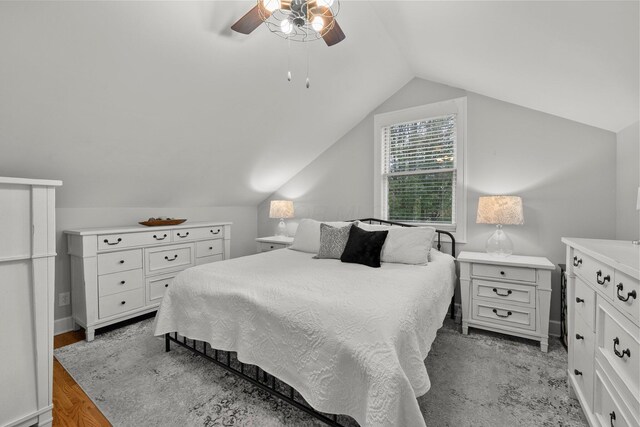 bedroom featuring a ceiling fan and lofted ceiling