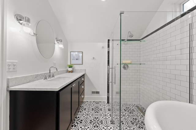 bathroom with vanity, visible vents, lofted ceiling, a freestanding bath, and a shower stall