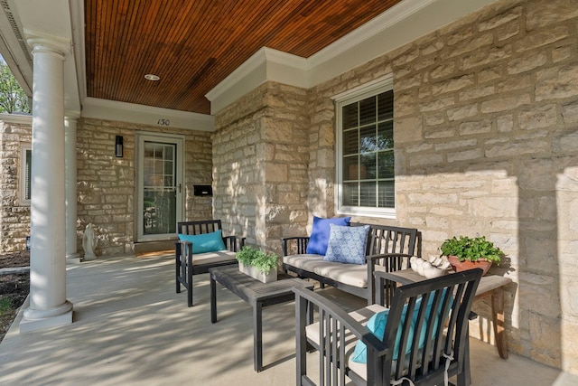 view of patio featuring a porch and an outdoor living space