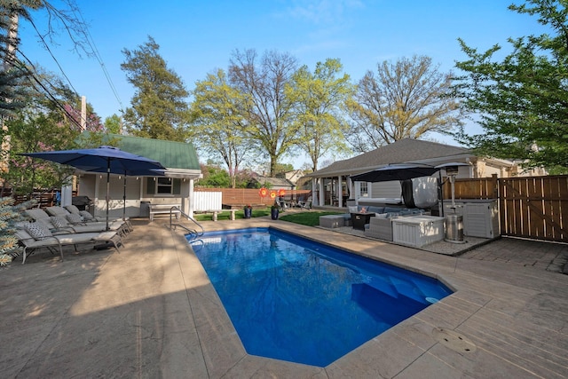 view of pool with a fenced in pool, fence, a patio, and outdoor lounge area