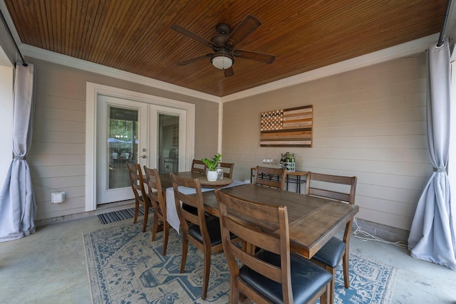 dining area with wooden ceiling, ceiling fan, french doors, and concrete floors