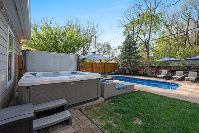 view of swimming pool featuring a hot tub, a fenced in pool, a fenced backyard, and a patio area