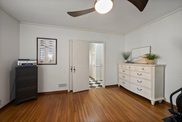 bedroom featuring baseboards, ornamental molding, dark wood-type flooring, and visible vents