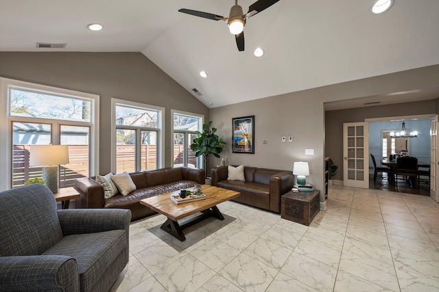 living area featuring recessed lighting, visible vents, marble finish floor, and ceiling fan with notable chandelier
