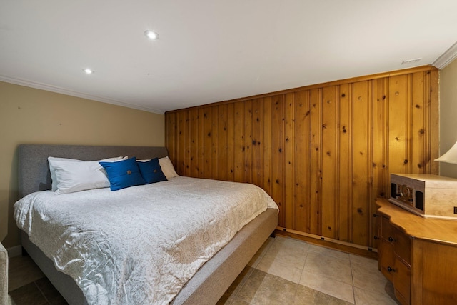 bedroom with crown molding, wood walls, light tile patterned flooring, and recessed lighting