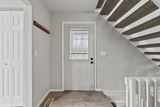 3018 Cooper Bluff Dr, Columbus, OH 43231 - doorway featuring baseboards, lofted ceiling, visible vents, and radiator