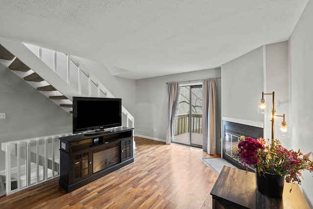 3018 Cooper Bluff Dr, Columbus, OH 43231 - living area with baseboards, a textured ceiling, and wood finished floors