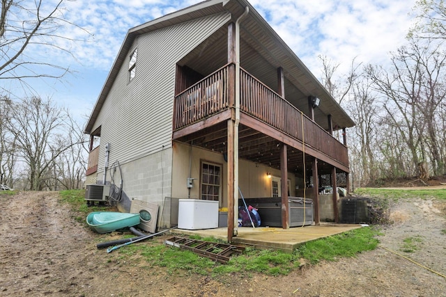 1335 Mingo Rd, Chillicothe, OH 45601 - rear view of property with a deck, a jacuzzi, and central air condition unit