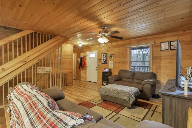 1335 Mingo Rd, Chillicothe, OH 45601 - living room with wood finished floors, wood ceiling, wooden walls, and a ceiling fan