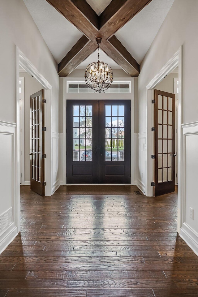11061 Kingfisher Pl, Plain City, OH 43064 - entryway featuring french doors, a notable chandelier, dark wood-style floors, and beamed ceiling