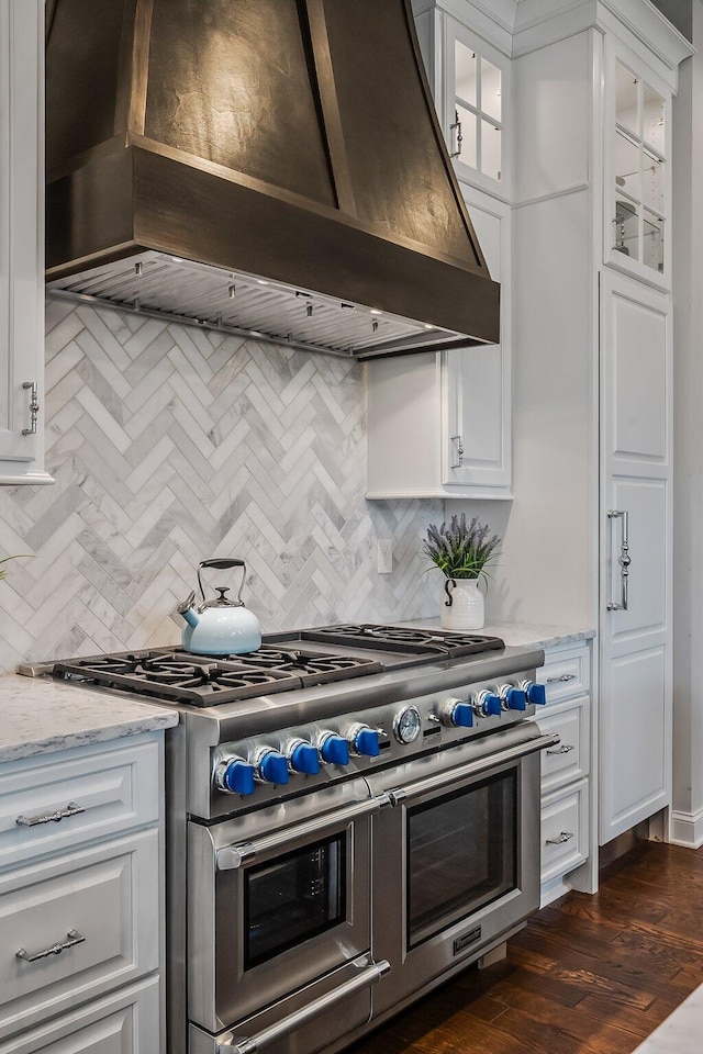 11061 Kingfisher Pl, Plain City, OH 43064 - kitchen featuring glass insert cabinets, white cabinetry, custom exhaust hood, and range with two ovens