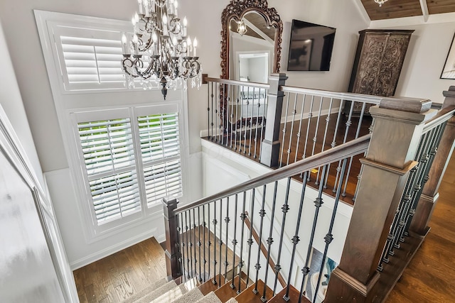 11061 Kingfisher Pl, Plain City, OH 43064 - stairway with wood finished floors, vaulted ceiling, and a notable chandelier