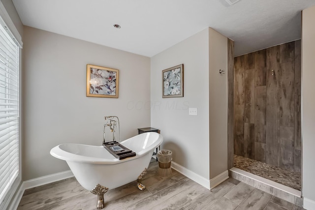 11061 Kingfisher Pl, Plain City, OH 43064 - full bath featuring a soaking tub, baseboards, wood finished floors, and tiled shower