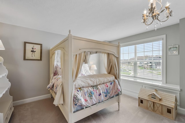 11061 Kingfisher Pl, Plain City, OH 43064 - carpeted bedroom featuring baseboards and an inviting chandelier