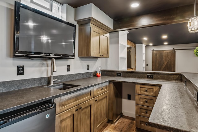 11061 Kingfisher Pl, Plain City, OH 43064 - kitchen with a sink, a barn door, brown cabinets, and dishwasher