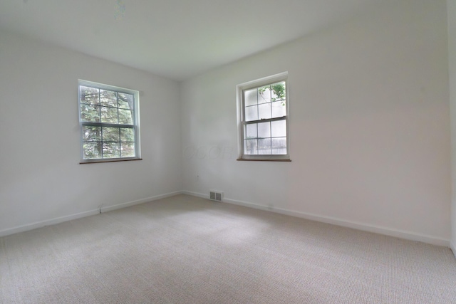 3161 Avalon Rd, Upper Arlington, OH 43221 - spare room featuring plenty of natural light and light colored carpet