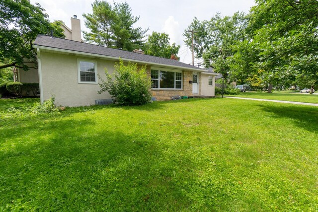 3161 Avalon Rd, Upper Arlington, OH 43221 - ranch-style house featuring a front lawn, a chimney, and stucco siding