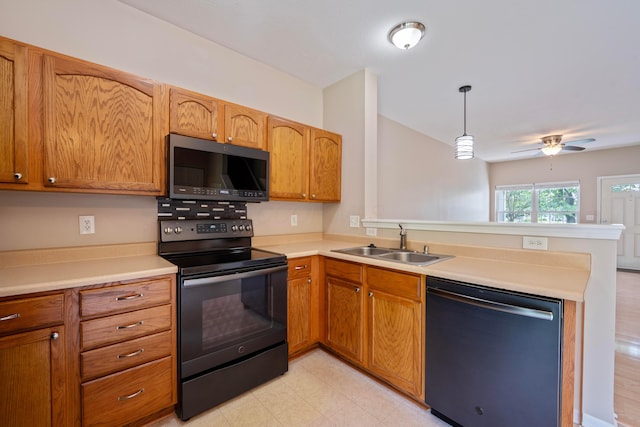 1218 Green Dr Unit 604, Columbus, OH 43230 - kitchen featuring dishwashing machine, black range with electric cooktop, a sink, a peninsula, and light countertops