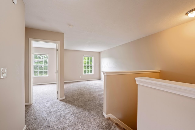 1218 Green Dr Unit 604, Columbus, OH 43230 - hallway with carpet, an upstairs landing, and baseboards