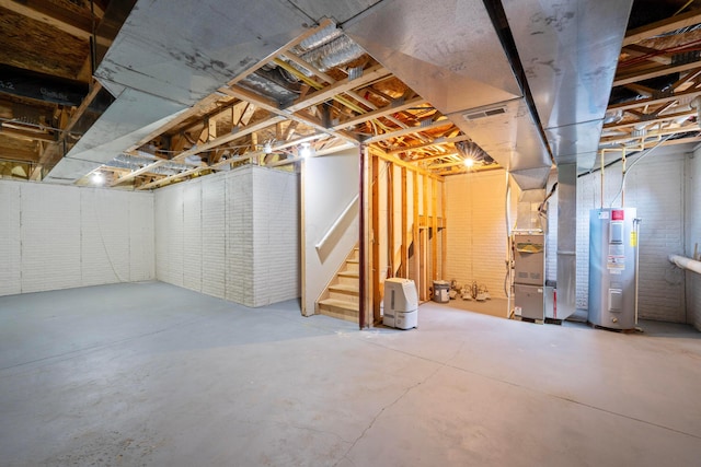 1218 Green Dr Unit 604, Columbus, OH 43230 - unfinished below grade area with water heater, stairway, and heating unit