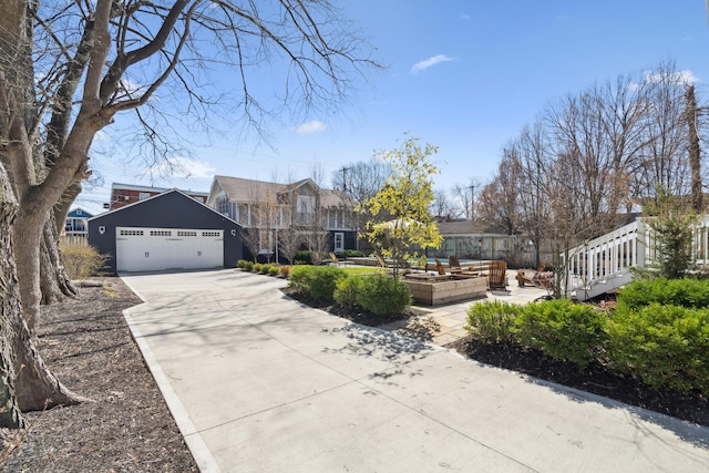 72 Miami Ave, Columbus, OH 43203 - view of front of property with driveway, a garage, and a vegetable garden