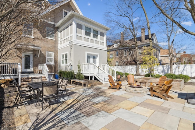 72 Miami Ave, Columbus, OH 43203 - view of patio / terrace with an outdoor fire pit, outdoor dining area, french doors, and fence
