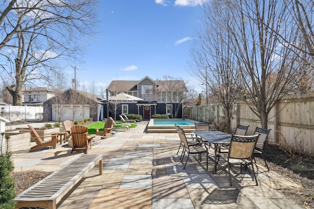 72 Miami Ave, Columbus, OH 43203 - view of patio with a fenced in pool, a fenced backyard, and outdoor dining space