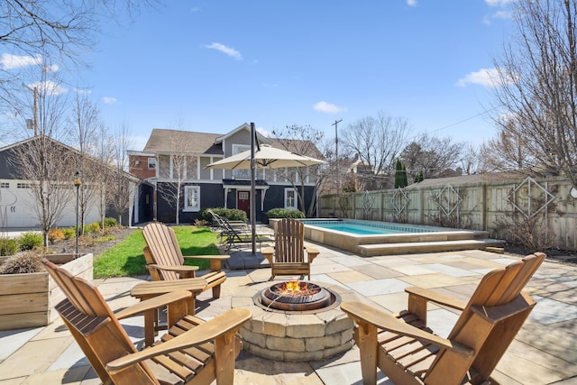 72 Miami Ave, Columbus, OH 43203 - view of patio featuring a fire pit, a fenced backyard, and a fenced in pool