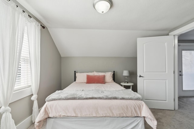 72 Miami Ave, Columbus, OH 43203 - bedroom featuring baseboards, vaulted ceiling, and carpet