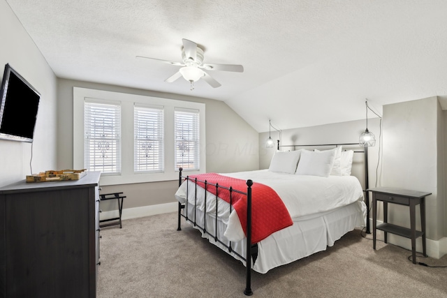 72 Miami Ave, Columbus, OH 43203 - bedroom with vaulted ceiling, carpet flooring, a textured ceiling, baseboards, and ceiling fan