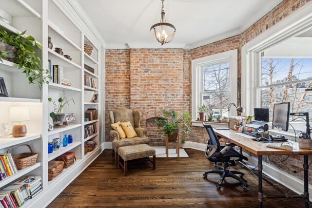 72 Miami Ave, Columbus, OH 43203 - home office featuring dark wood finished floors, ornamental molding, brick wall, and an inviting chandelier